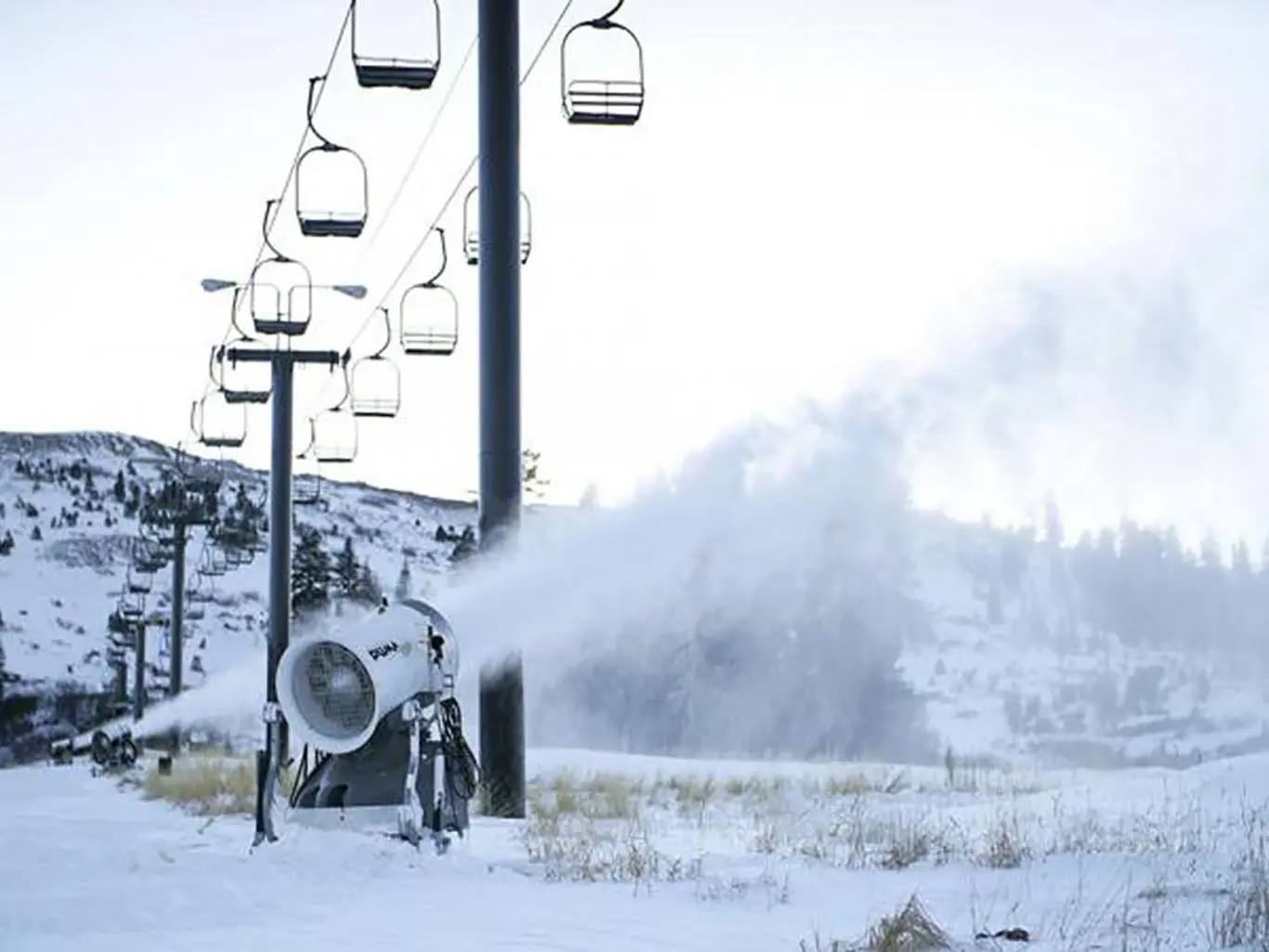 snow maker running under ski lift